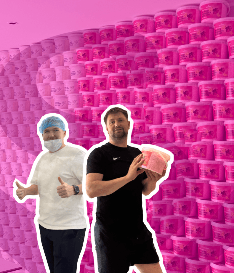 Louis and Michael, the Scentl founders, in front of stacks of Scentl tubs