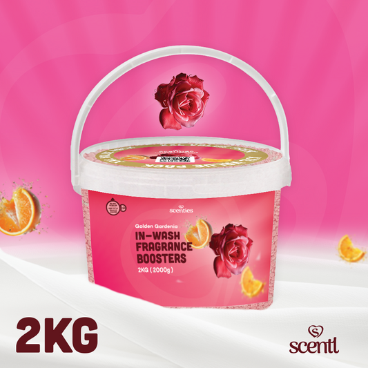 Pink container of Scentl in-wash fragrance boosters with roses and oranges on a pink background
